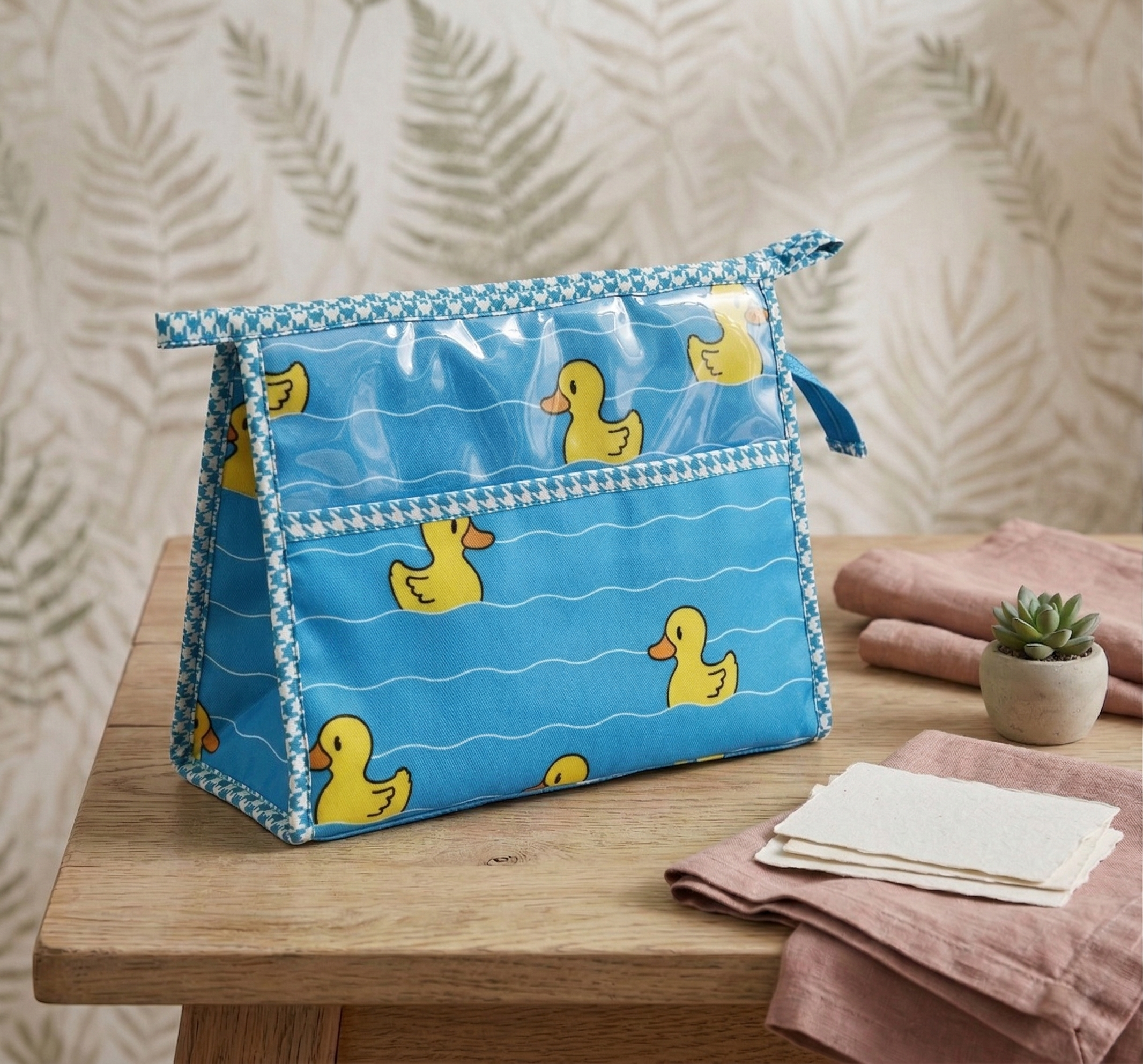 QUACKY WAVES PRINT TRIOZIP TOILETRY BAG